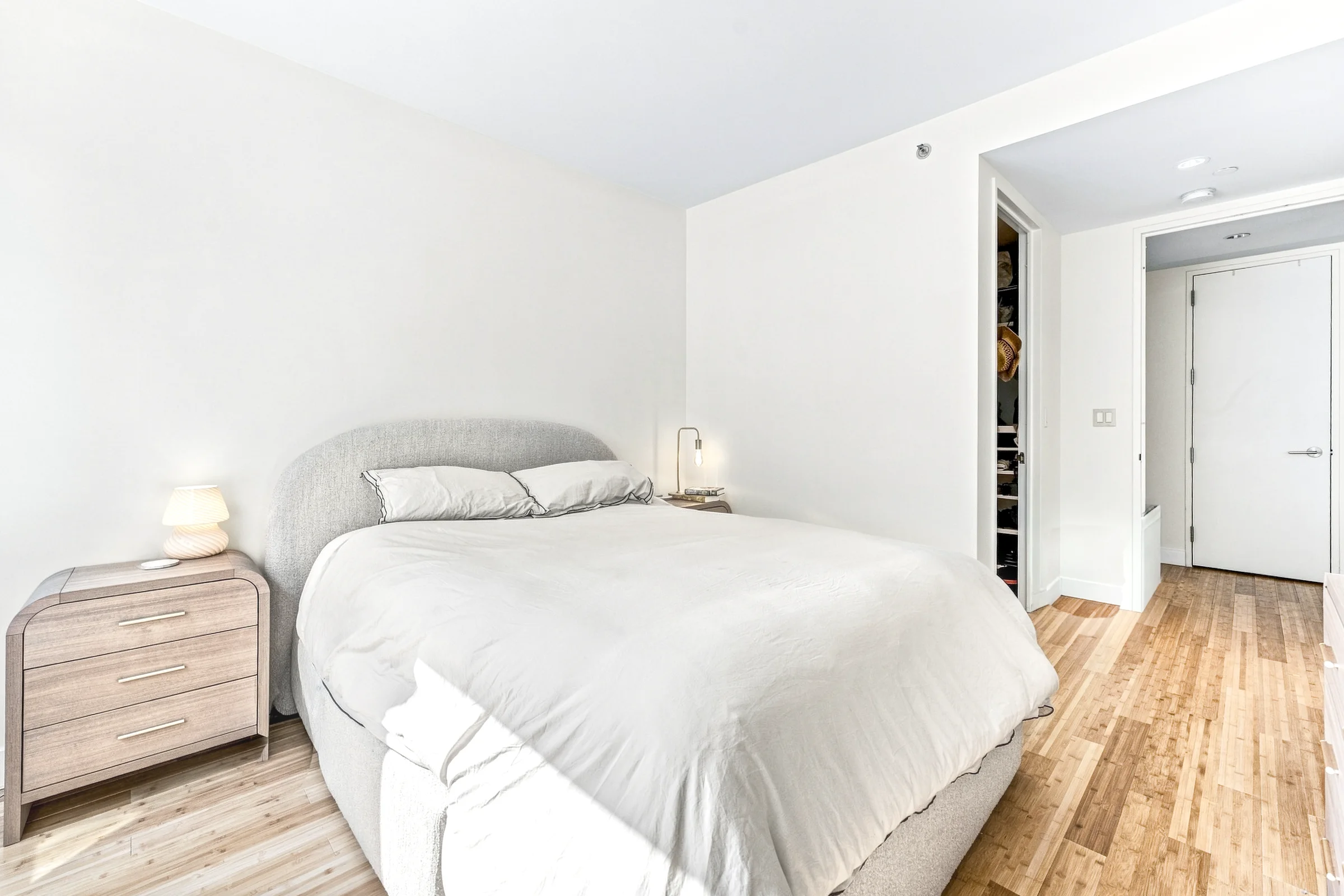 Soft natural light across a Manhattan apartment bedroom