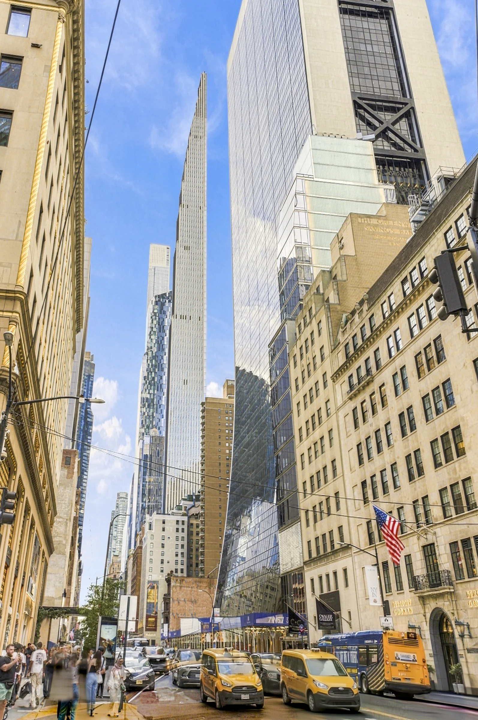 Yellow taxis on a Midtown Manhattan avenue beneath a slender supertall tower